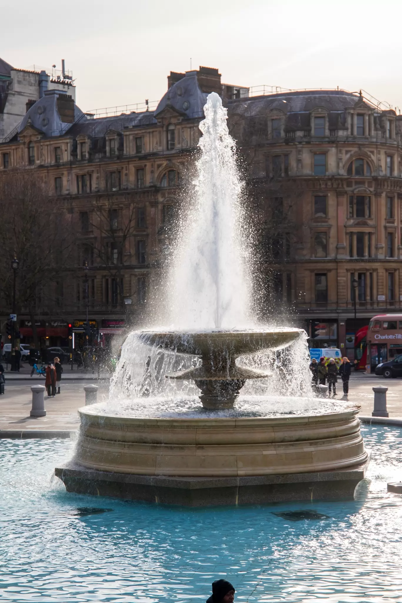 Fountains spraying water on Trafalgar Square in London, UK.