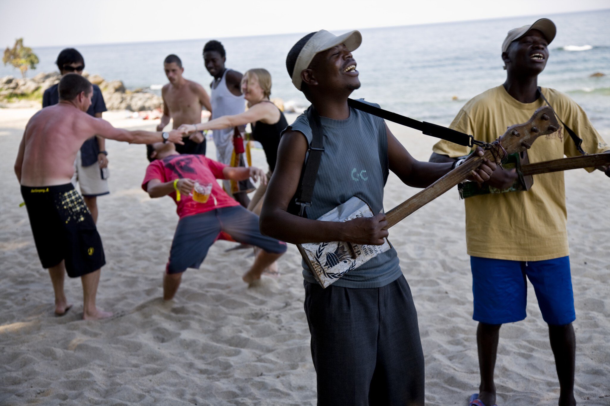 The Makambele Brothers band from the capital Lilongwe. Their instruments are home made out of tin NGO cans, carved wood metal strings. They entertain the locals and foreign tourist that have come to enjoy the Lake of Stars music Festival, Chinteche, Malawi.  (Photo by Christopher Pillitz/Getty Images)
82036059
africa, beached, dancing, fun, home