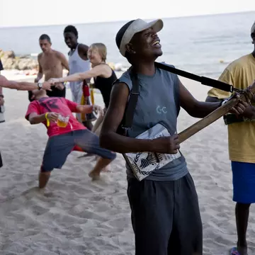 The Makambele Brothers band from the capital Lilongwe. Their instruments are home made out of tin NGO cans, carved wood metal strings. They entertain the locals and foreign tourist that have come to enjoy the Lake of Stars music Festival, Chinteche, Malawi.  (Photo by Christopher Pillitz/Getty Images)
82036059
africa, beached, dancing, fun, home