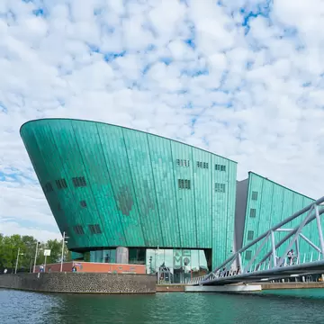 View of the Nemo Museum from across the water in Amsterdam, Netherlands. 