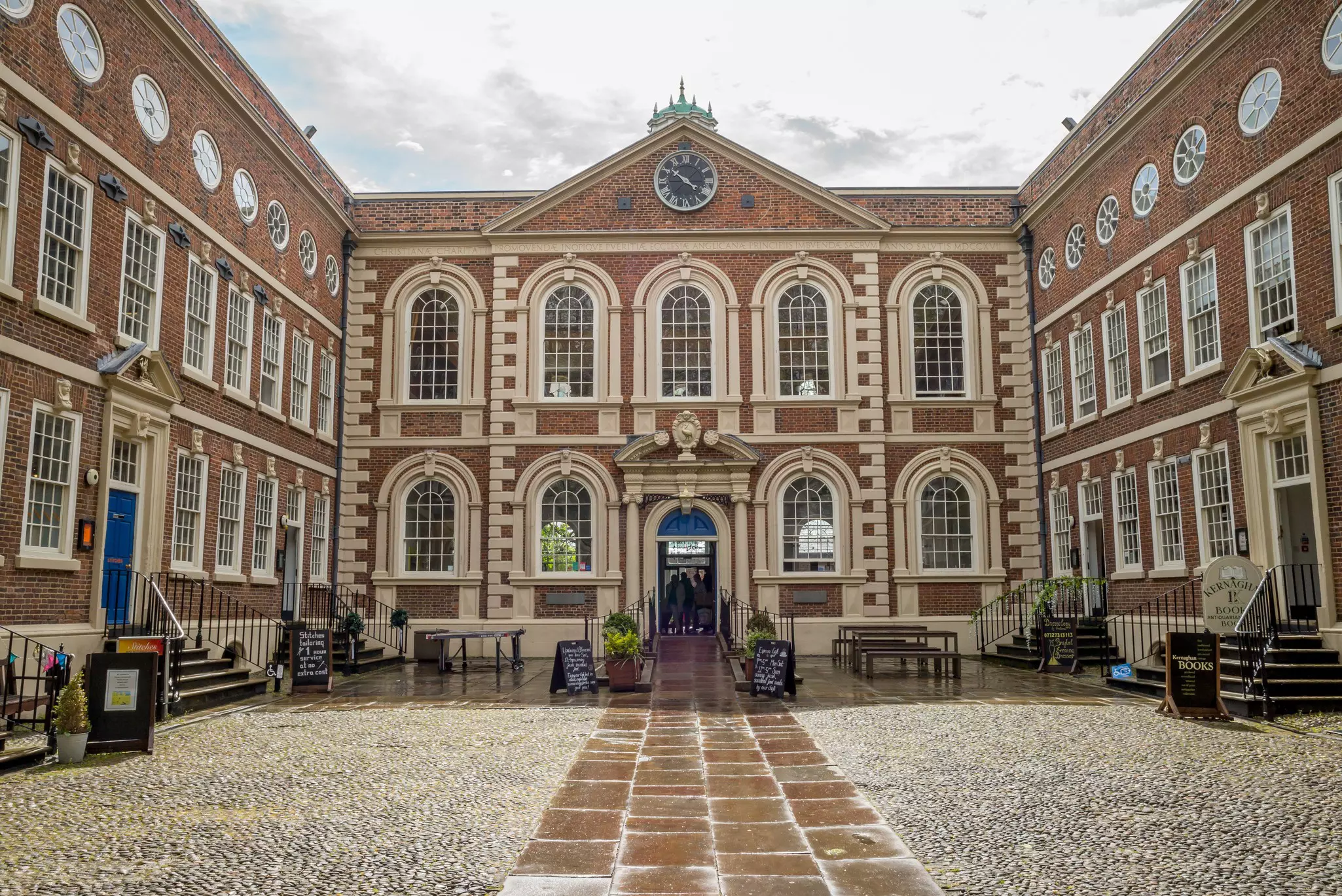Bluecoat Chambers, Liverpool. The red-brick building has cream highlights and startling blue doors.