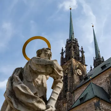 Brno, Czech Republic. The Statue of Saint Paul looking at the Cathedral of Saint Peter and Paul. 