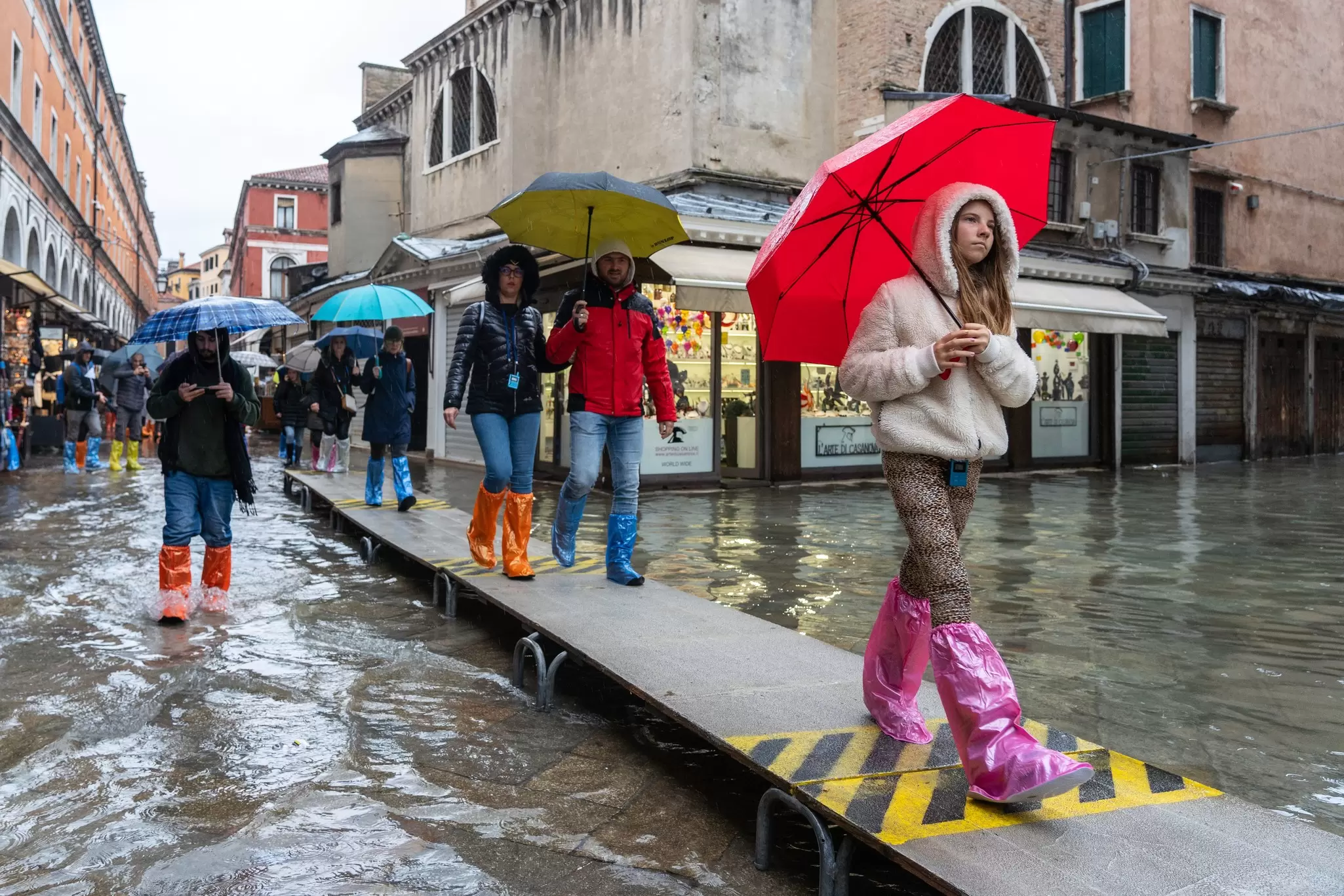 VENICE, ITALY - November 24, 2019: flood (acqua alta) in Venice, Italy. Venice high water. Tourists in Venice during a flood. Natural disaster. drama during the flood, License Type: media, Download Time: 2024-11-15T13:44:18.000Z, User: fabricencoredesign31, Editorial: true, purchase_order: 56530 - Guidebooks, job: Global Publishing WIP, client: Venice & the Veneto 12, other: Fabrice Robin
