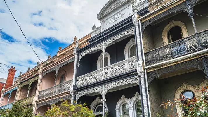 Balconies on town houses with elaborate ironwork in Melbourne.
