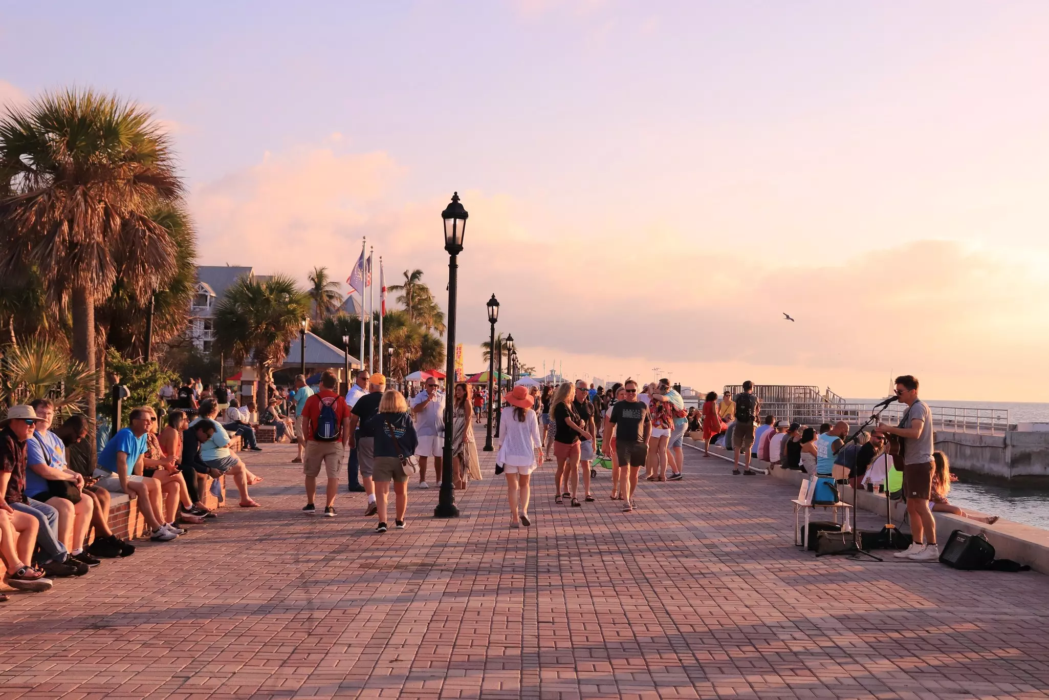 Tourists enjoying sunset time in Mallory Square, a famous tourist place in the city.