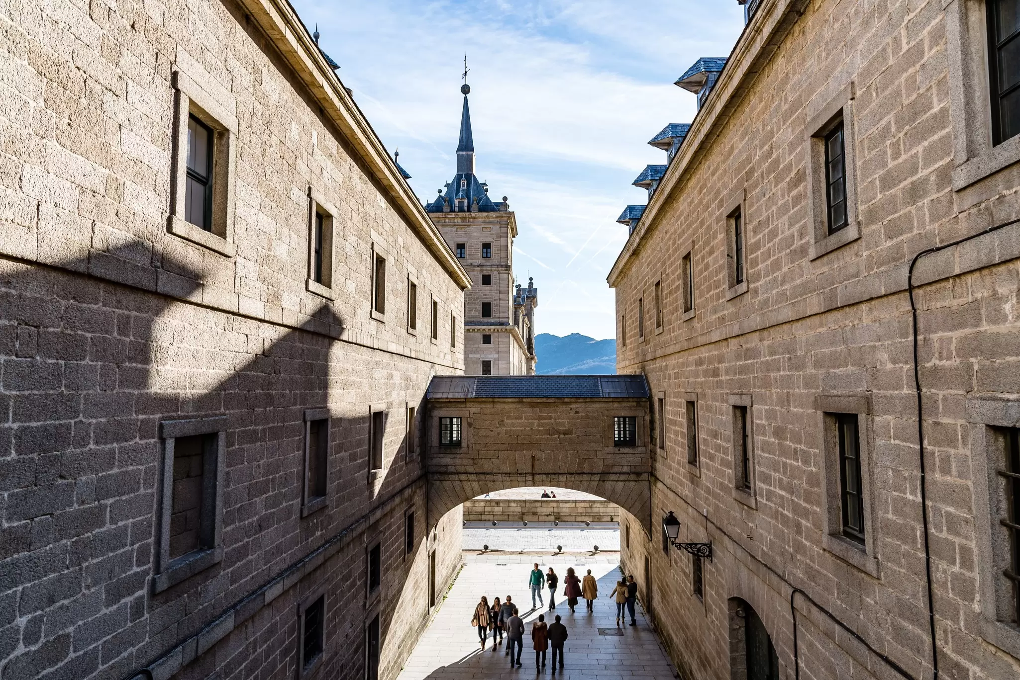 View of people entering the Real Monasterio de San Lorenzo de El Escorial complex near the city of Madrid in Spain.