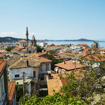 Terracotta rooftops of houses on Agean coast seen from Taksiyarhis Pension.