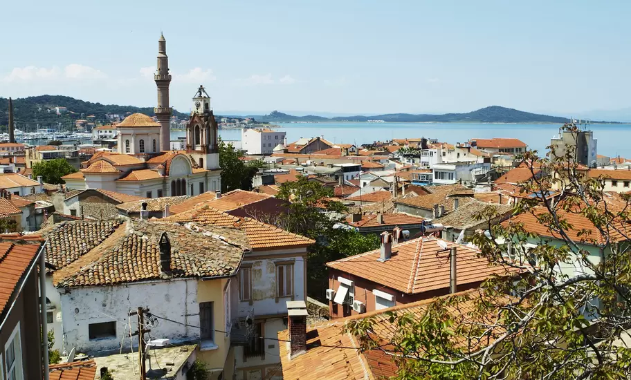 Terracotta rooftops of houses on Agean coast seen from Taksiyarhis Pension.