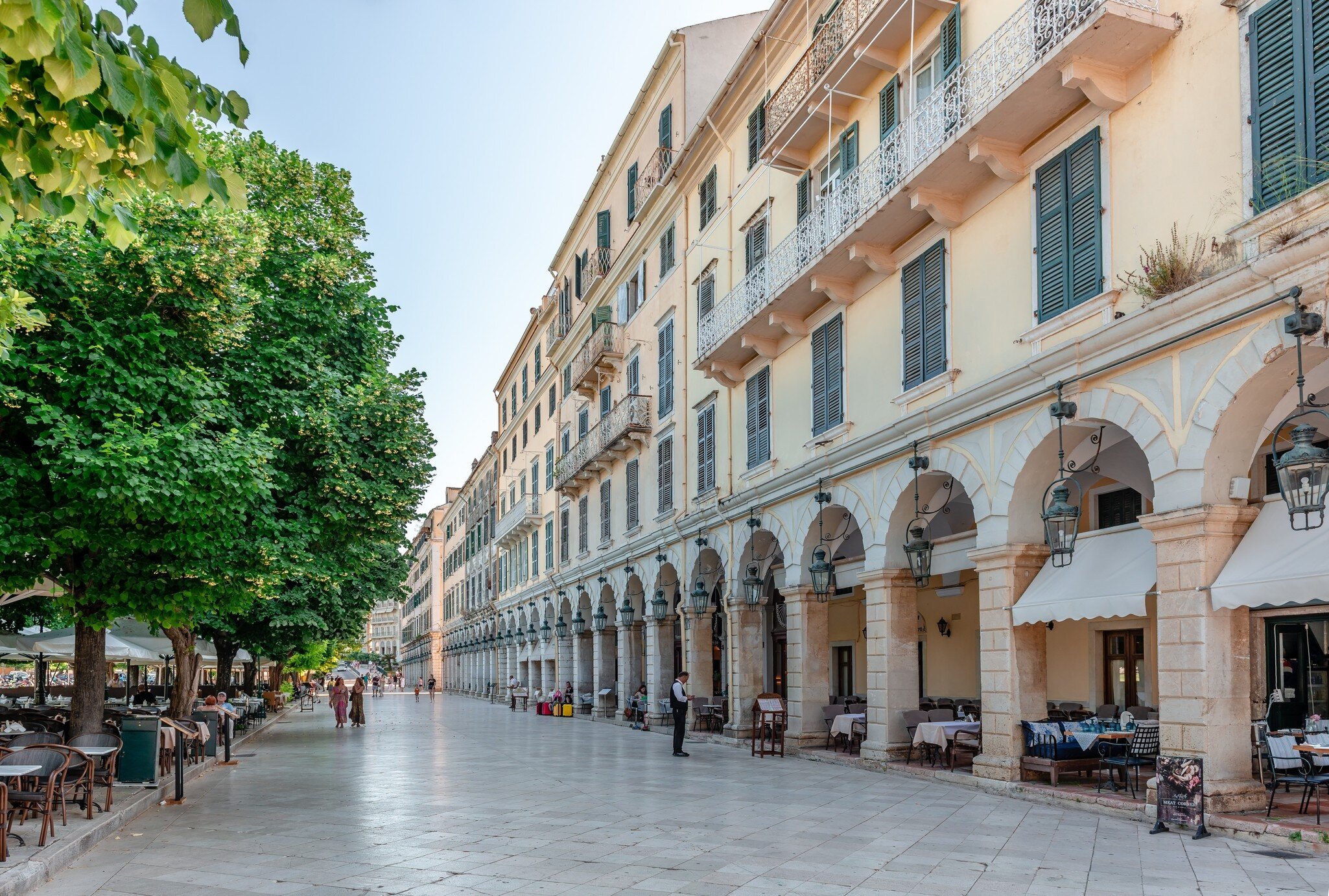 Corfu, Greece - June 3 2022: Liston, a pedestrian street with arcaded terraces and fashionable cafes in the western edge of Spianada Square in the center of the city.; Shutterstock ID 2164255557;