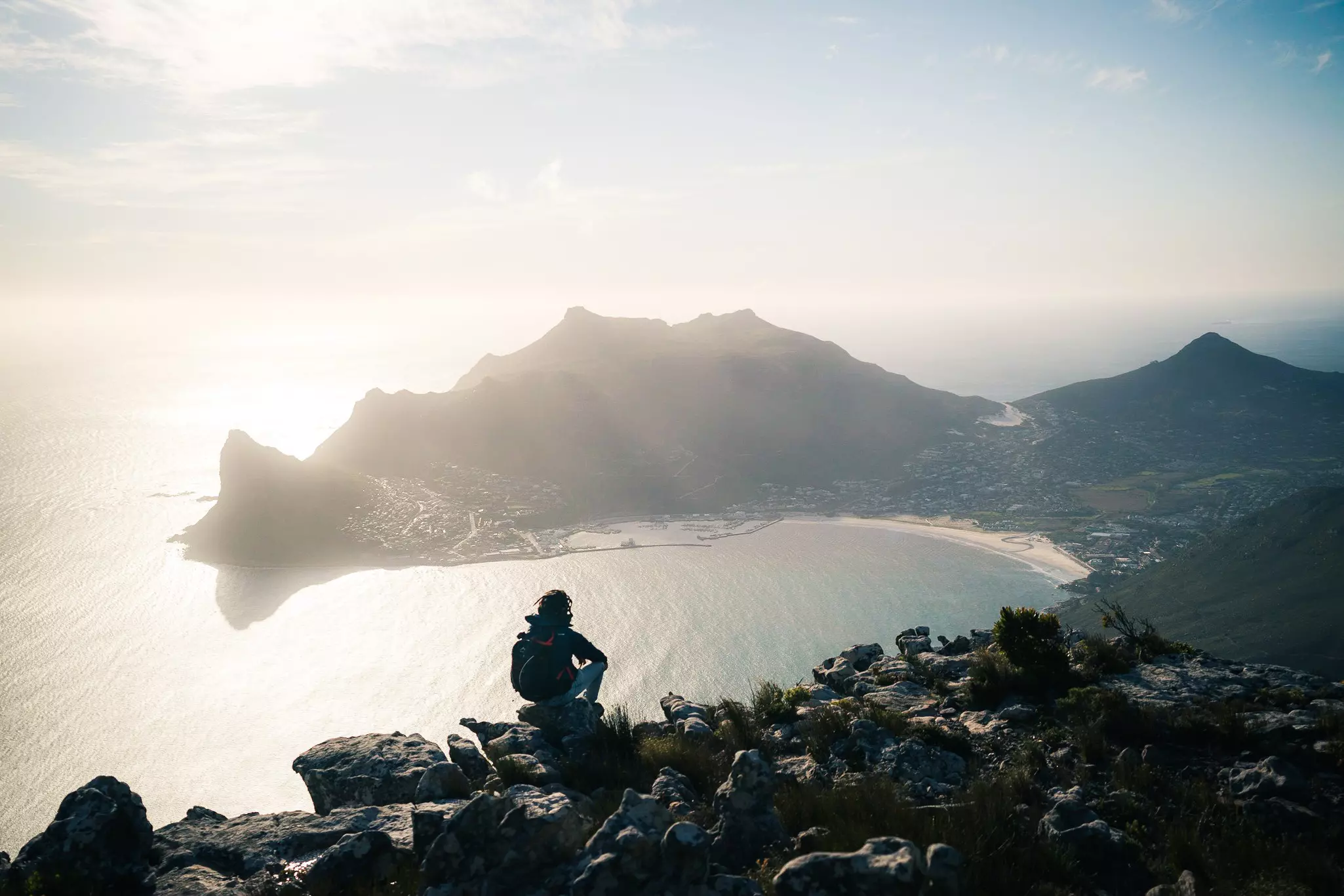 The hiking view from Silvermine Dam overlooking Hout Bay and Sentinel Peak in Cape Town, South Africa.