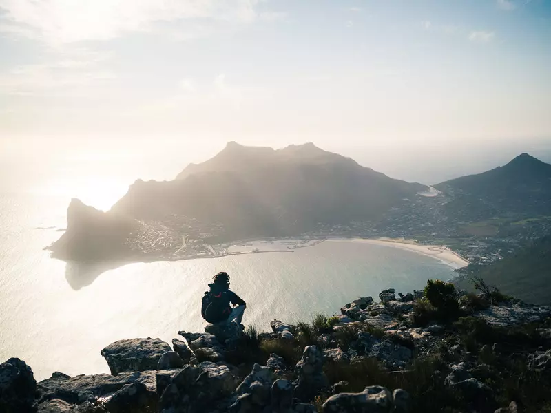 The hiking view from Silvermine Dam overlooking Hout Bay and Sentinel Peak in Cape Town, South Africa.