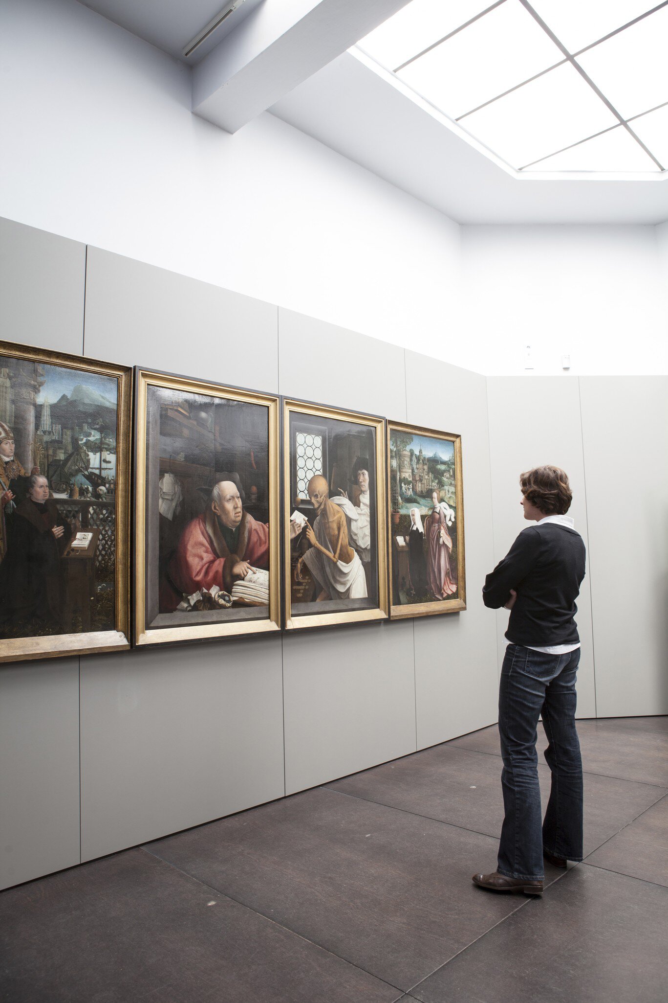 Woman viewing paintings (Hugo Van der Goes - St Hippolyte's Triptich) at Groeningemuseum.
Lonely Planet Traveller Magazine, Issue 48, Bruges, An embarrassment, of riches