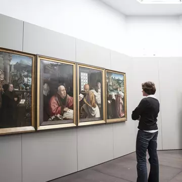 Woman viewing paintings (Hugo Van der Goes - St Hippolyte's Triptich) at Groeningemuseum.
Lonely Planet Traveller Magazine, Issue 48, Bruges, An embarrassment, of riches