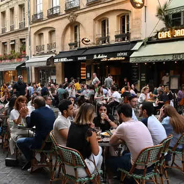 Restaurants and cafes are now reopening, but al fresco dining is still the preference for many © Edward Berthelot / Getty Images