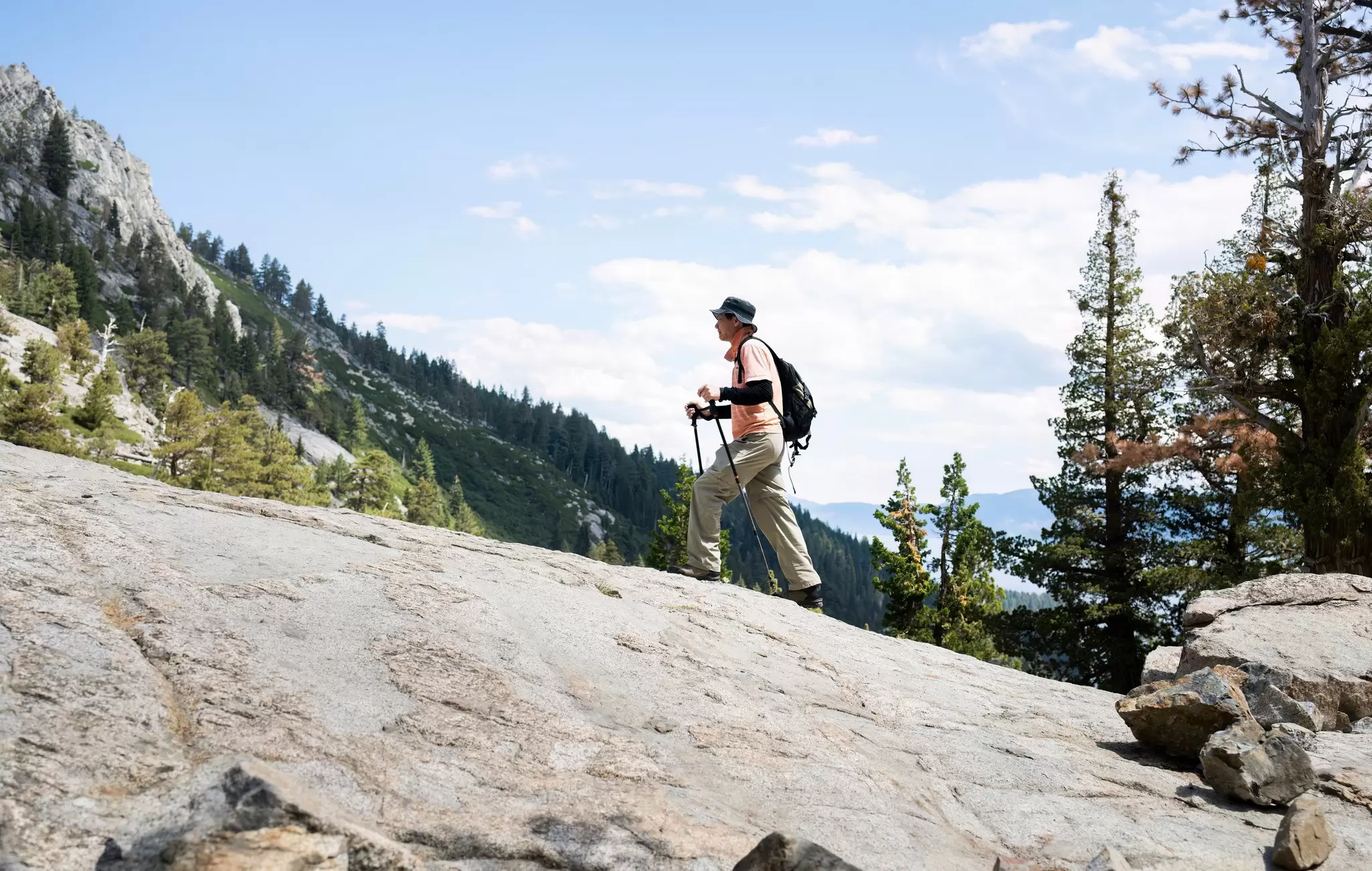 Man hiking Eagle Lake Trail, Emerald Bay State Park, Lake Tahoe, California.