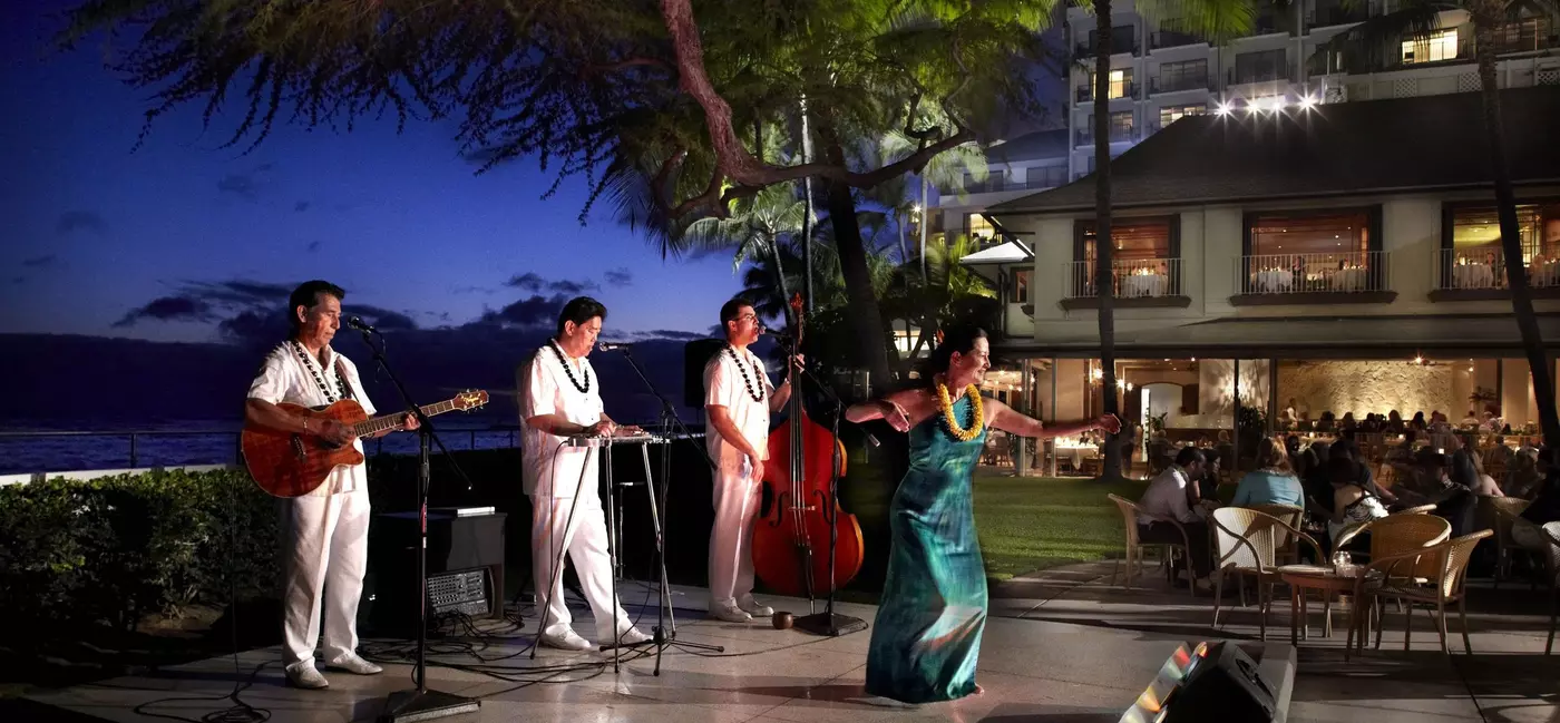 Dance performers on an outdoor stage at a luxury hotel