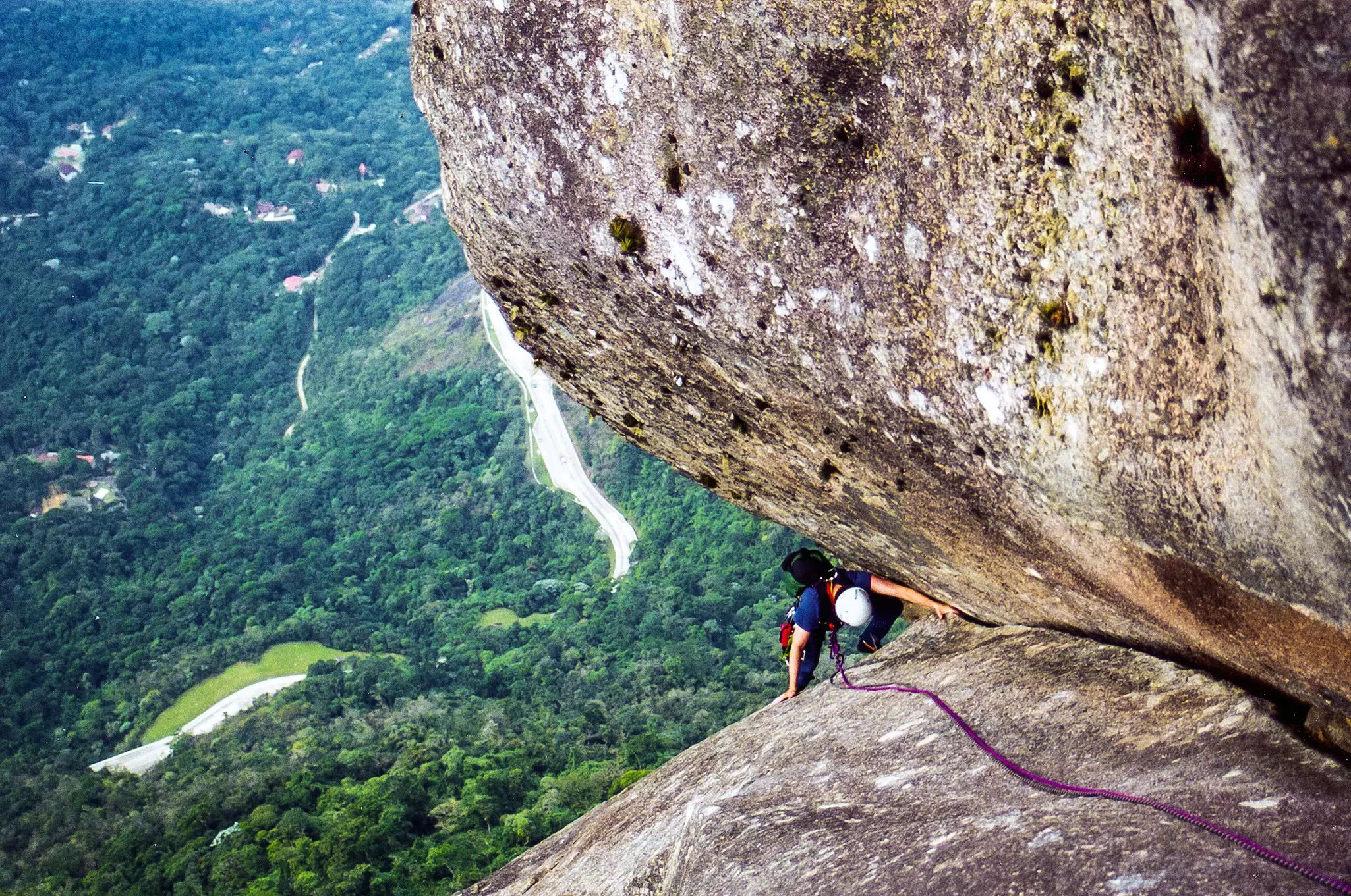 Overhead shot of a climber ascending a steep rock face
