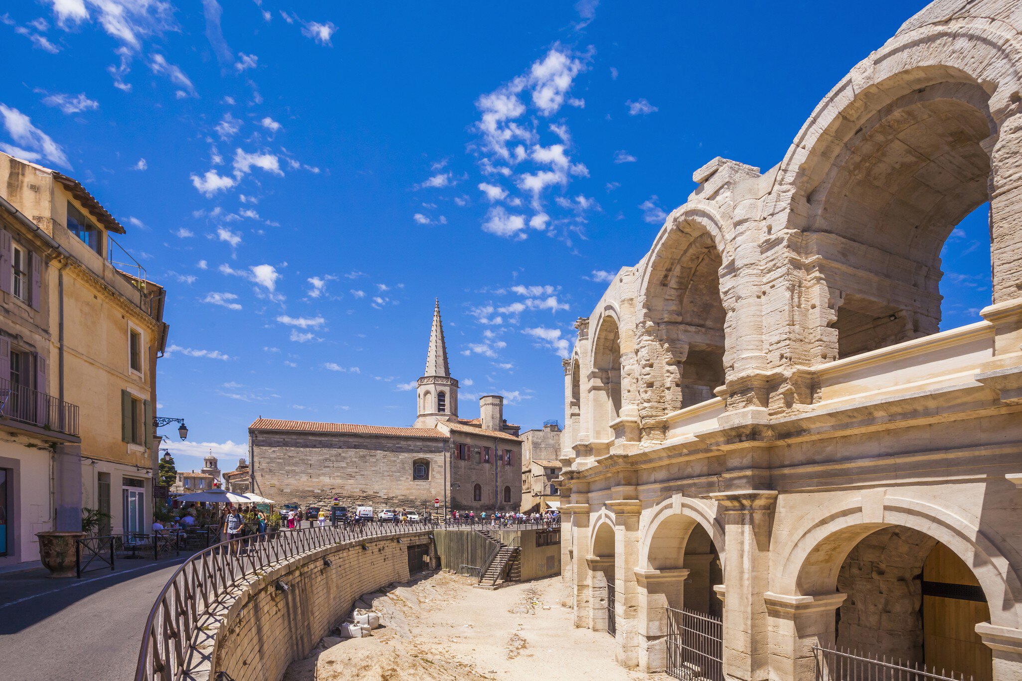 The remains of a Roman amphitheater in a city center. 