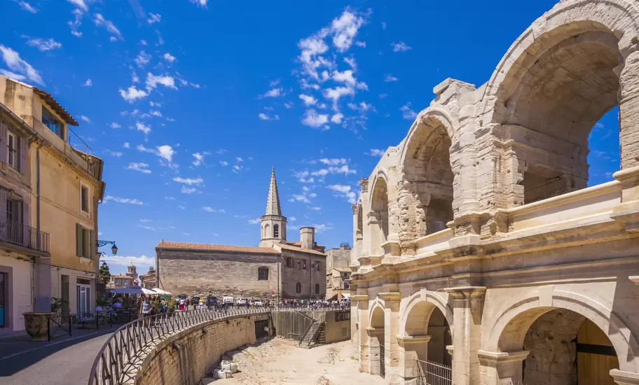 The remains of a Roman amphitheater in a city center. 