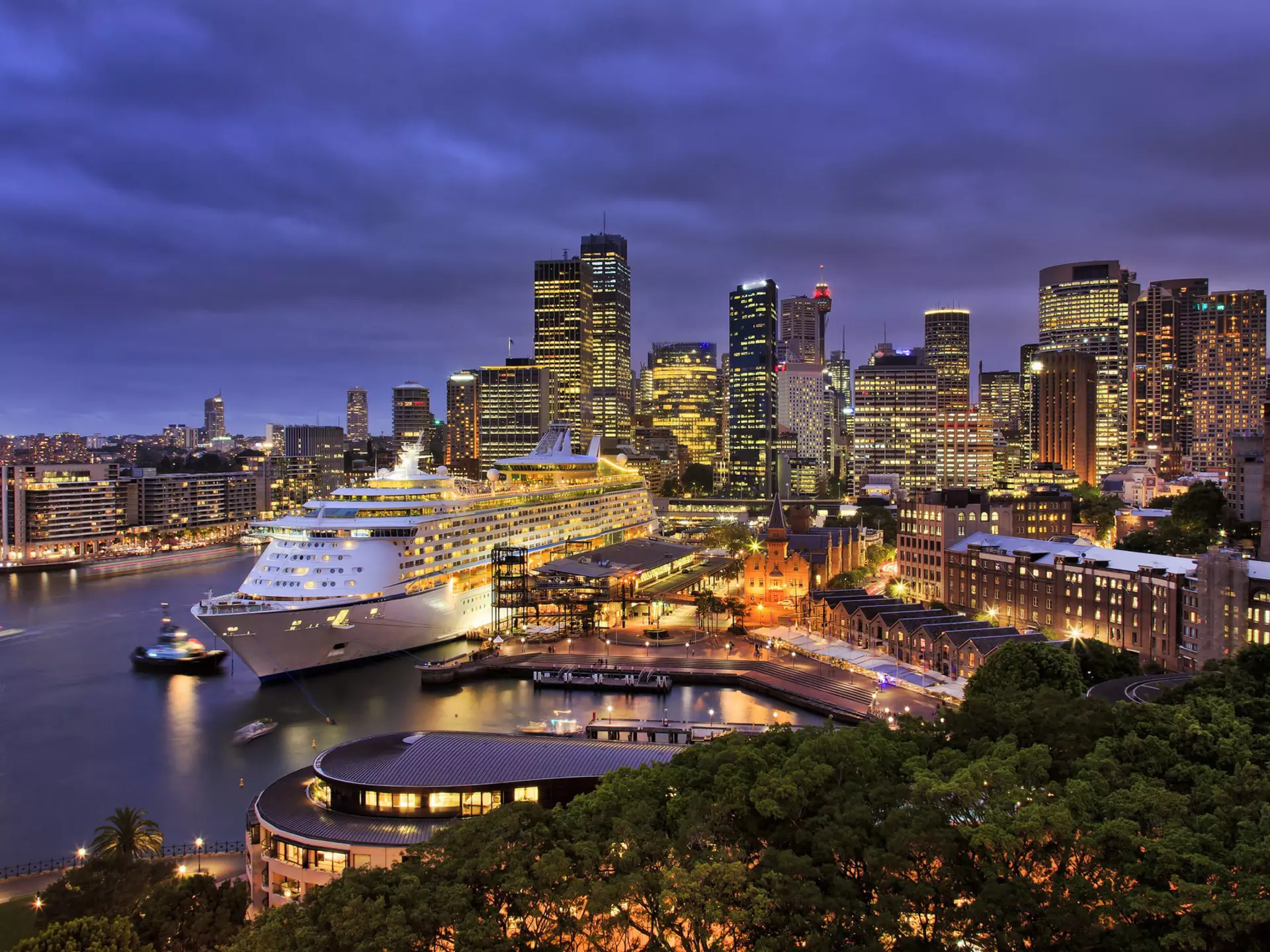 A giant cruise ship docked at Sydney harbour with the city skyline at night.
266033717
cruise, tower, destination, australia, liner, travel, urban, landmark, quay, night, luxury, port, twilight, modern, ships, cloudy, architecture, city, blue, terminal, colorful, panorama, sunset, illumination, sky, house, sea, sydney, water, bridge, voyager, giant, lights, cityscape, nsw, cbd, harbour