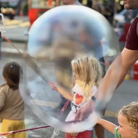 The writer's son blowing bubbles at a street festival in Urbana, Illinois. Sarah Stocking for Lonely Planet
