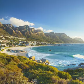 Beach and Twelve Apostles mountain in Camps Bay near Cape Town in South Africa.