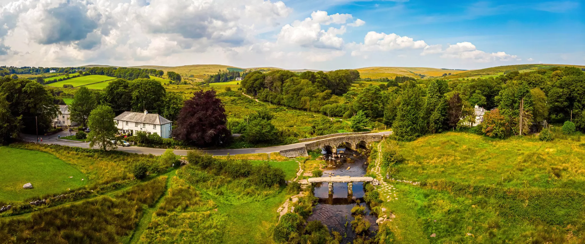 A view of Postbridge Clapper Bridge in Dartmoor National Park is a vast moorland in the county of Devon, in southwest England