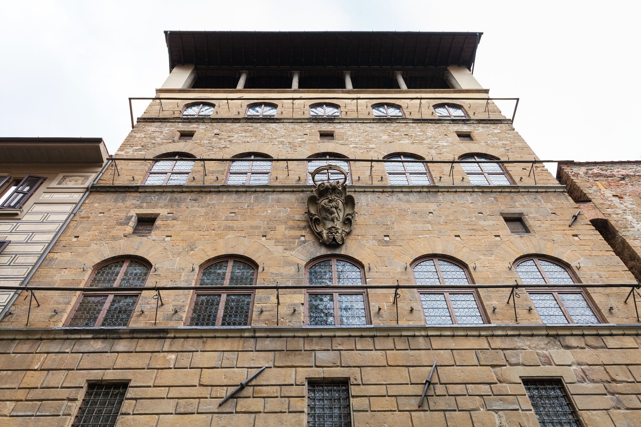 Florence, Italy - November 5, 2016: wall of Palazzo Davanzati, home of Museum of the Old Florentine House (Museo della Casa Fiorentina Antica). The Palace was erected in second half of 14th cent