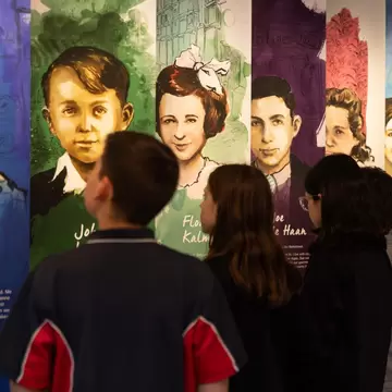 Children looking at a visual exhibition at the Melbourne Holocaust Museum in Melbourne, Australia. 