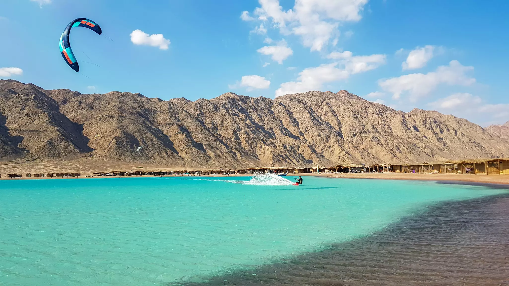 A person kitesurfing in the Blue Lagoon, Dahab