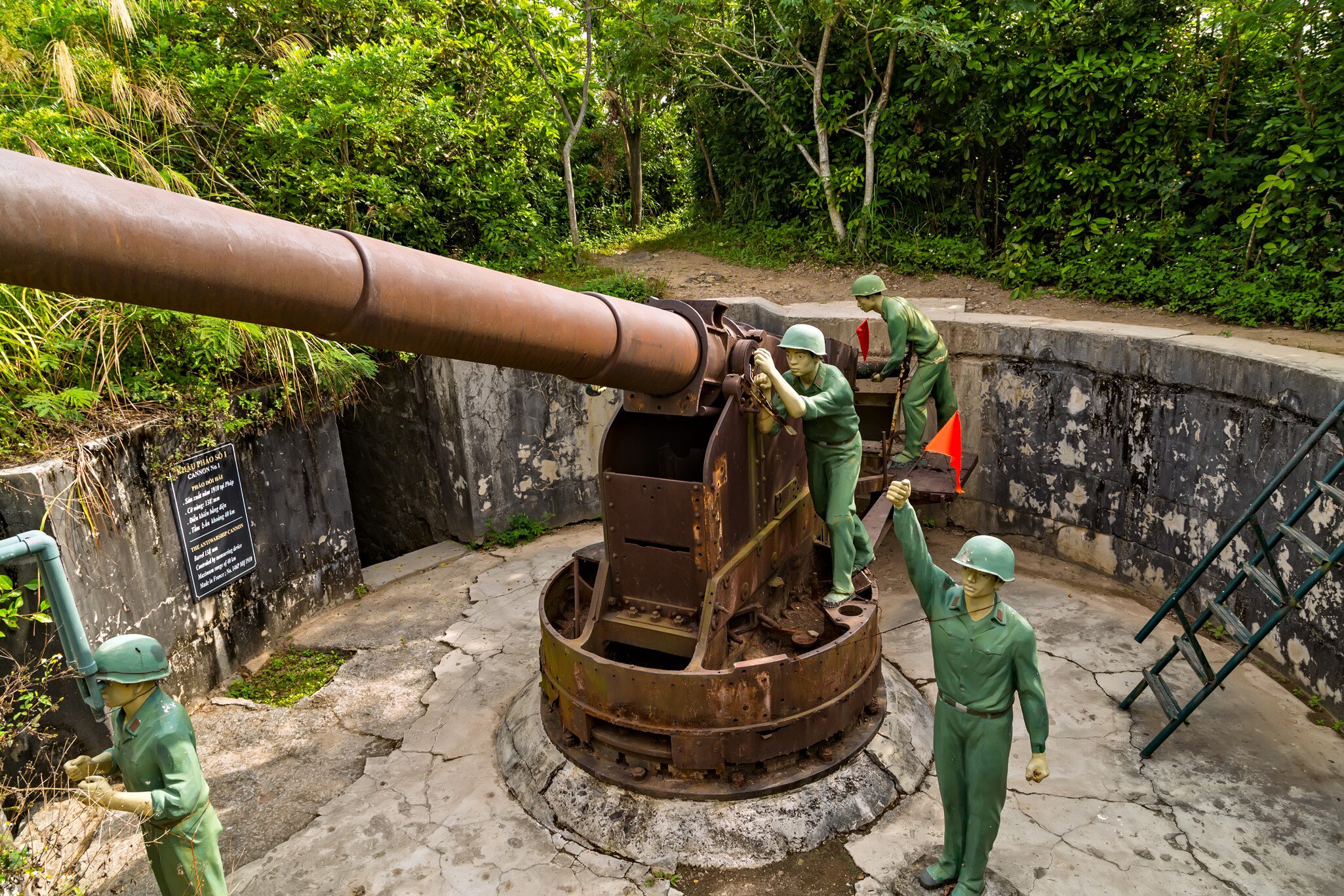 Cannon Fort Artillery gun surrounded by mannequin soldiers, Cat Ba Island, Vietnam.