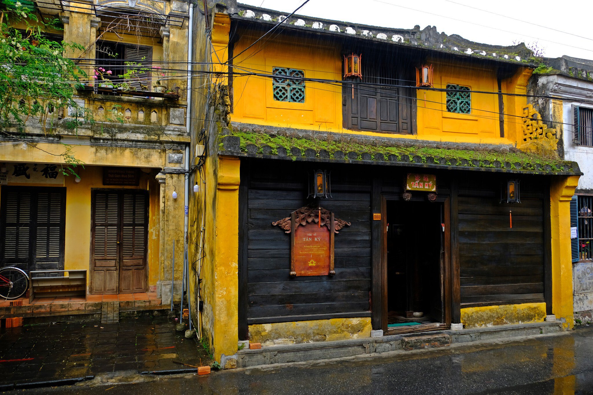 Exterior of the Old House of Tan Ky in Hoi An, Vietnam, on a rainy day.