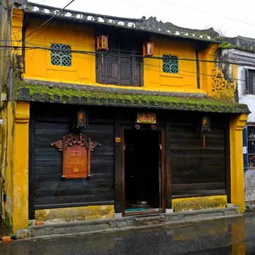 Exterior of the Old House of Tan Ky in Hoi An, Vietnam, on a rainy day.