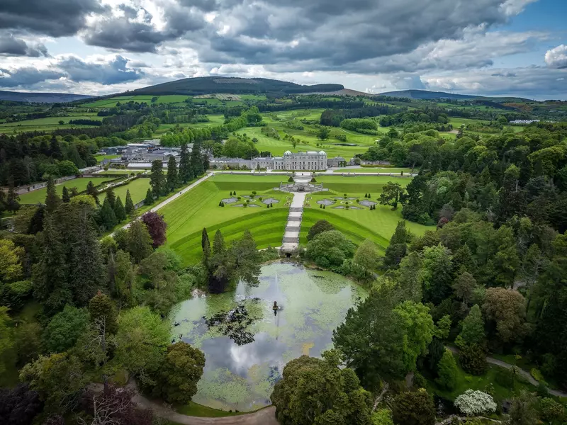  Aerial View of Powerscourt Estate  in Ireland The fountain in Powerscourt Gardens, echoing the elegance of Powerscourt House against the scenic backdrop Landscape around Wicklow mountains Dublin, 