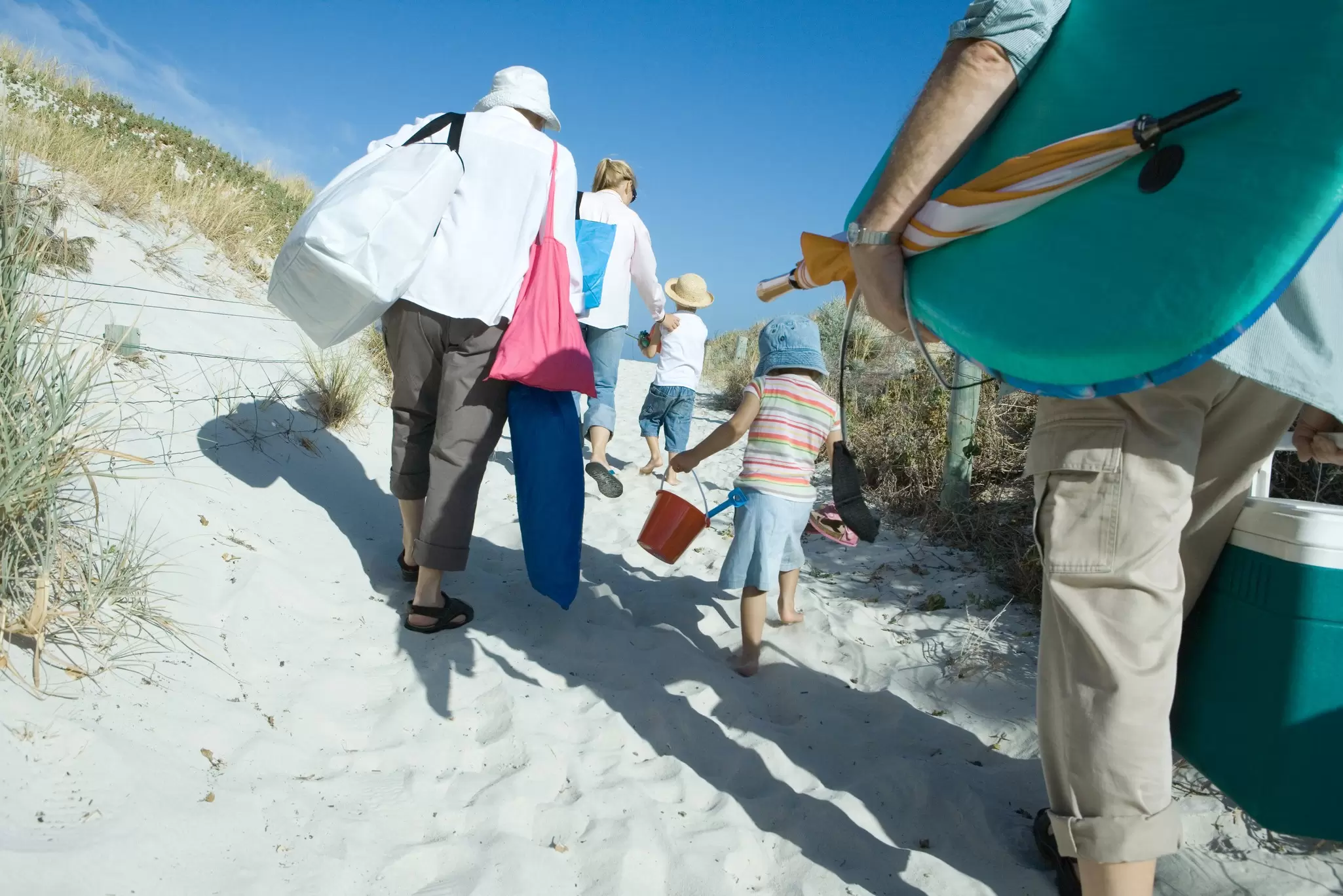 Load them up! Get the kids to help you carry everything. PhotoAlto / Sigrid Olsson / Getty Images