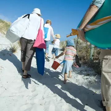 Load them up! Get the kids to help you carry everything. PhotoAlto / Sigrid Olsson / Getty Images