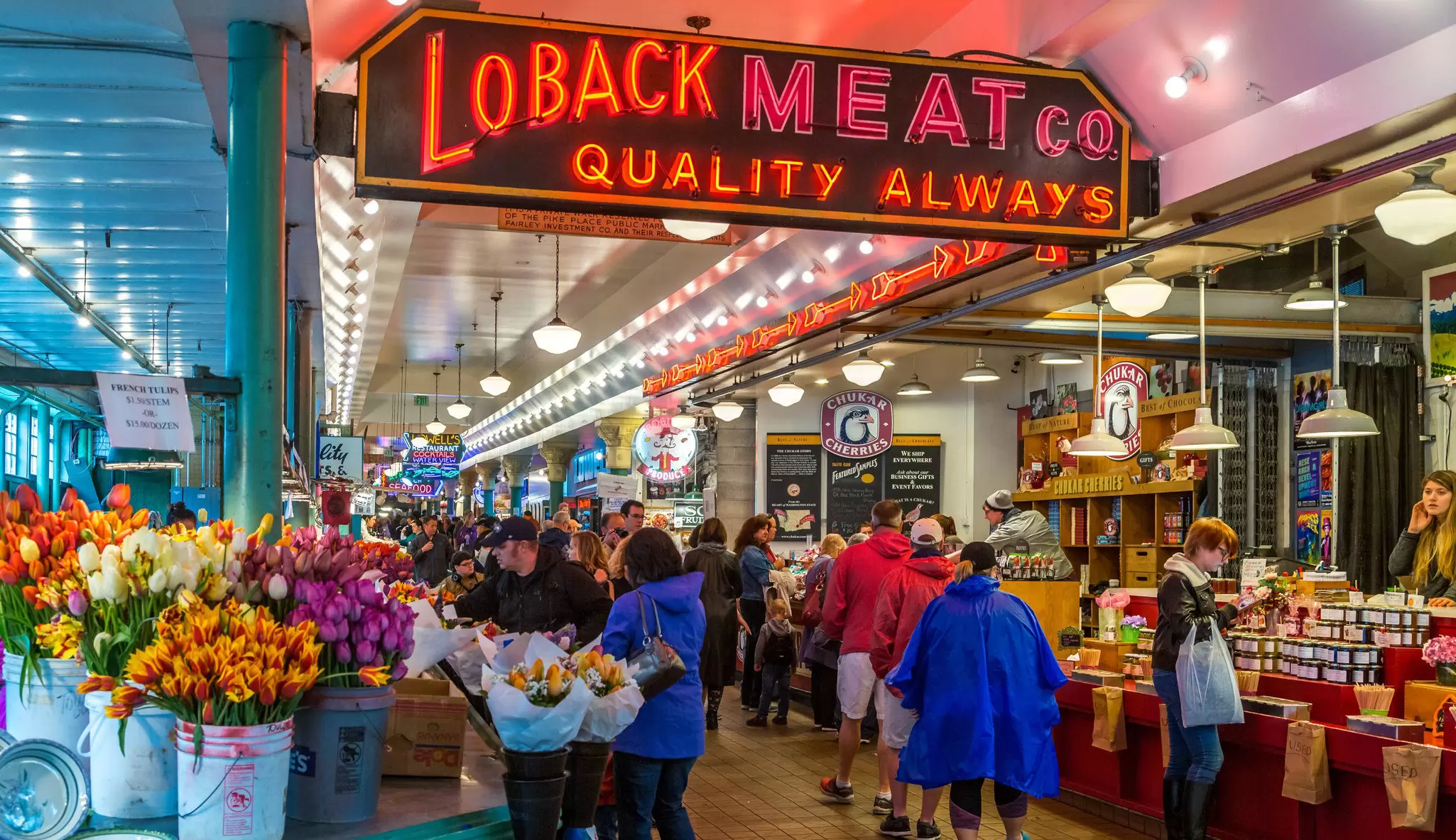 Visitors crowd stalls at Pike Place Market