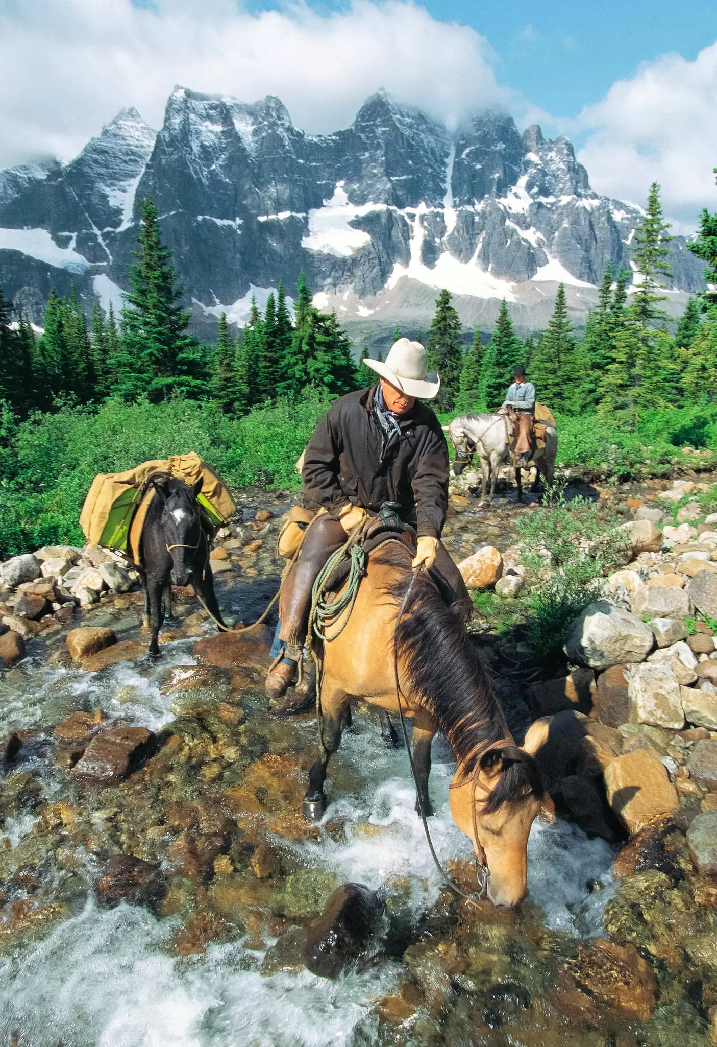 Horsepackers water their horses in the remote Tonquin Valley.