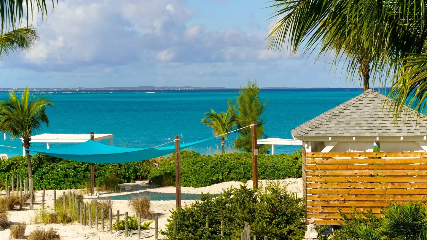 Providenciales, Turks and Caicos Islands. Grace Bay in Turks and Caicos is renown for its iconic turquoise waters, white sand beaches, seaside cabanas, sunny skies and warm weather.