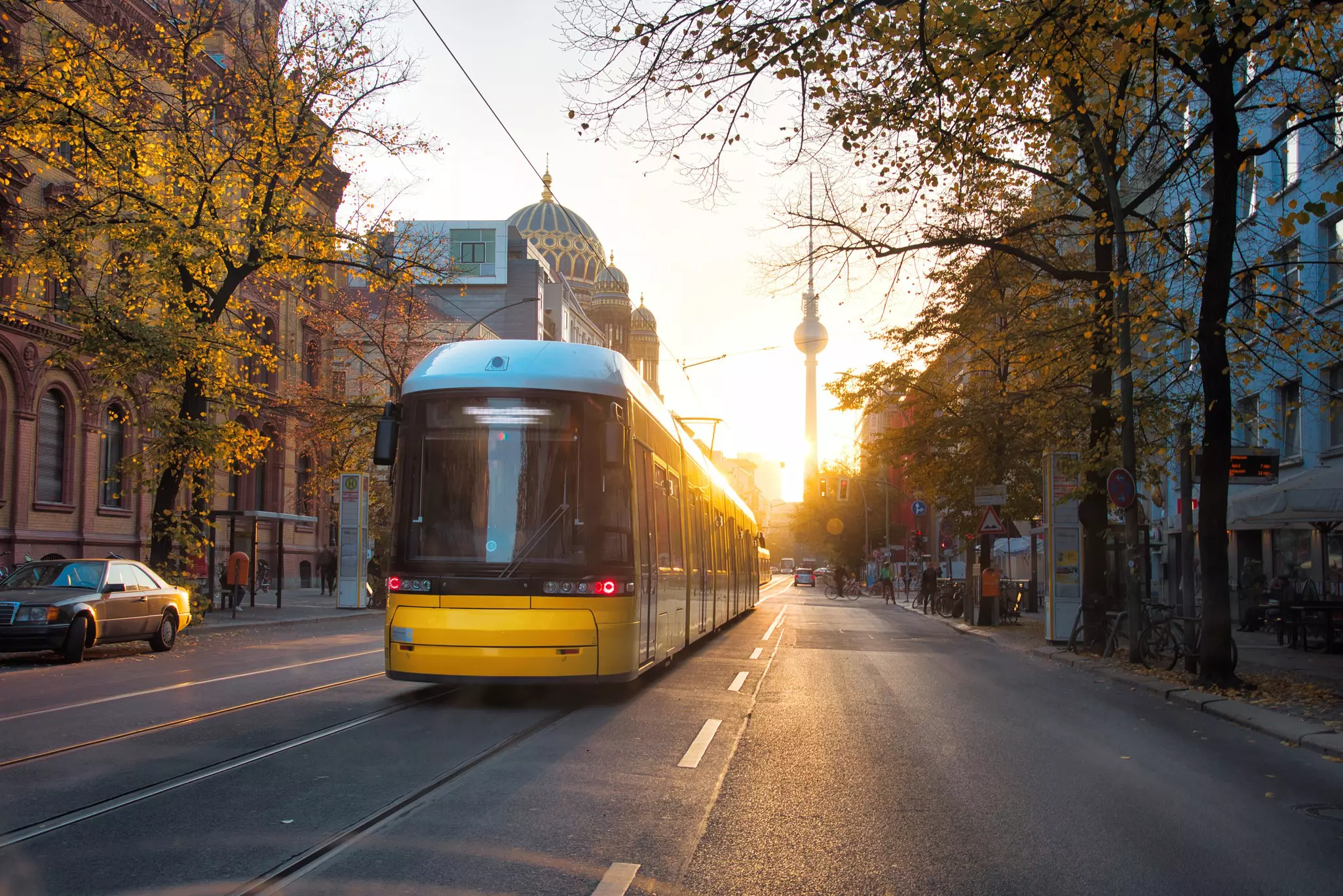A yellow tram in the early morning sunlight along Berlin's Oranienburger Strasse © golero / Getty Images / iStockphoto