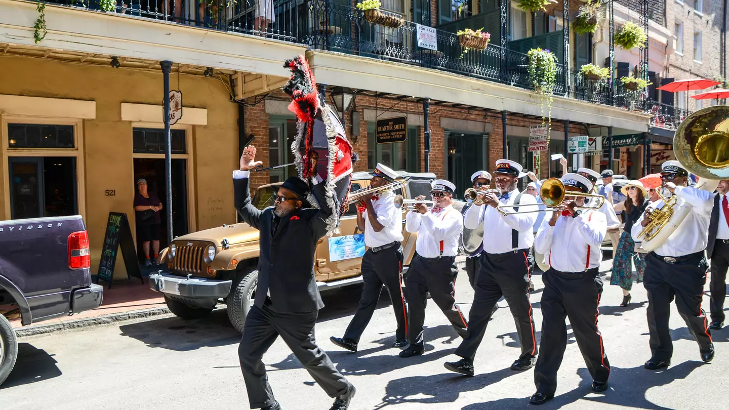 A second line band plays as it marches in the French Quarter.