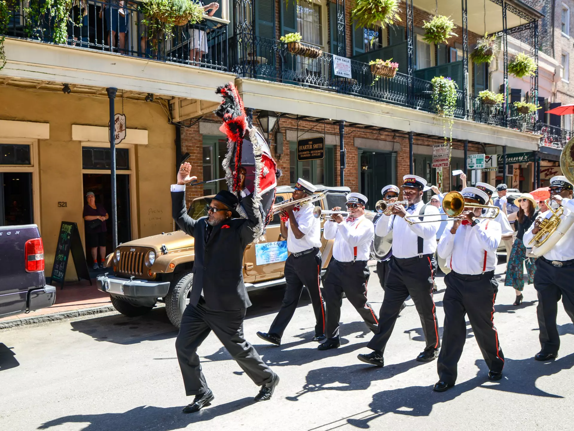 A second line band plays as it marches in the French Quarter.