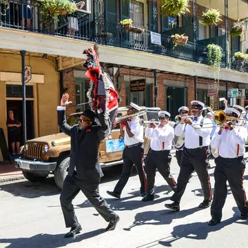 A second line band plays as it marches in the French Quarter.