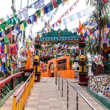 Main entranceway strewn with prayer flags at Observatory Hill in Darjeeling, West Bengal, India. 