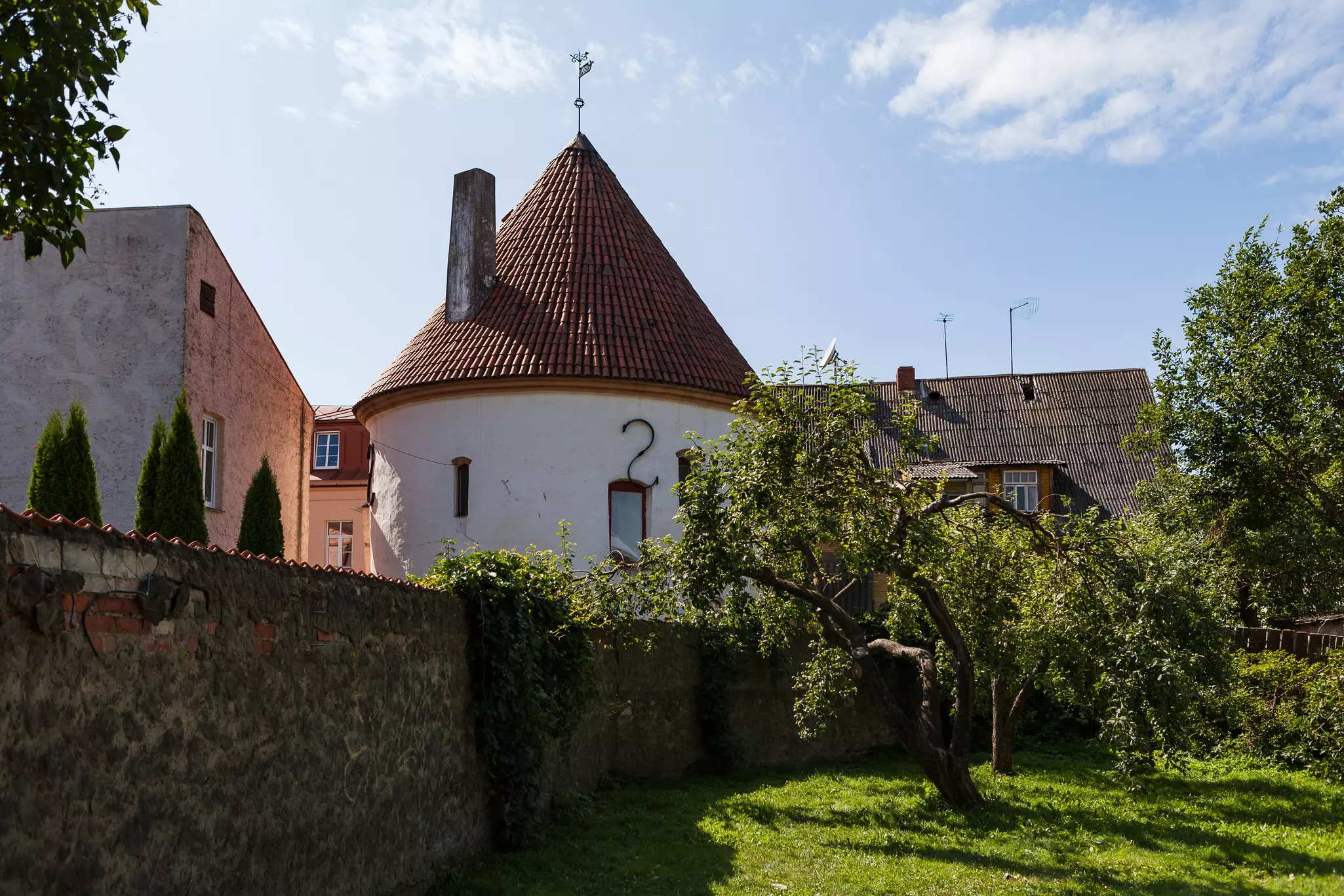 An old, white tower in the courtyard of Parnu