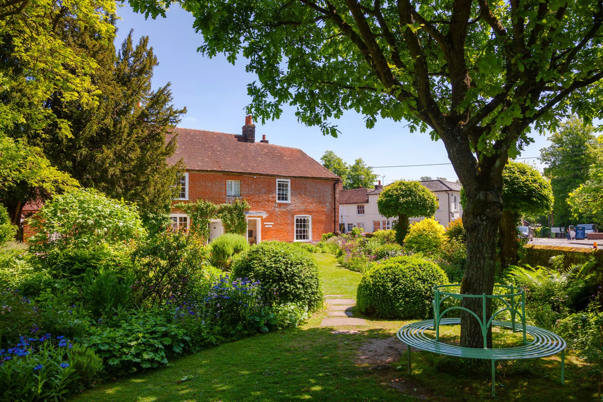 Round bench at the formal garden of Chawton Cottage, museum of novelist Jane Austen, Hampshire
,