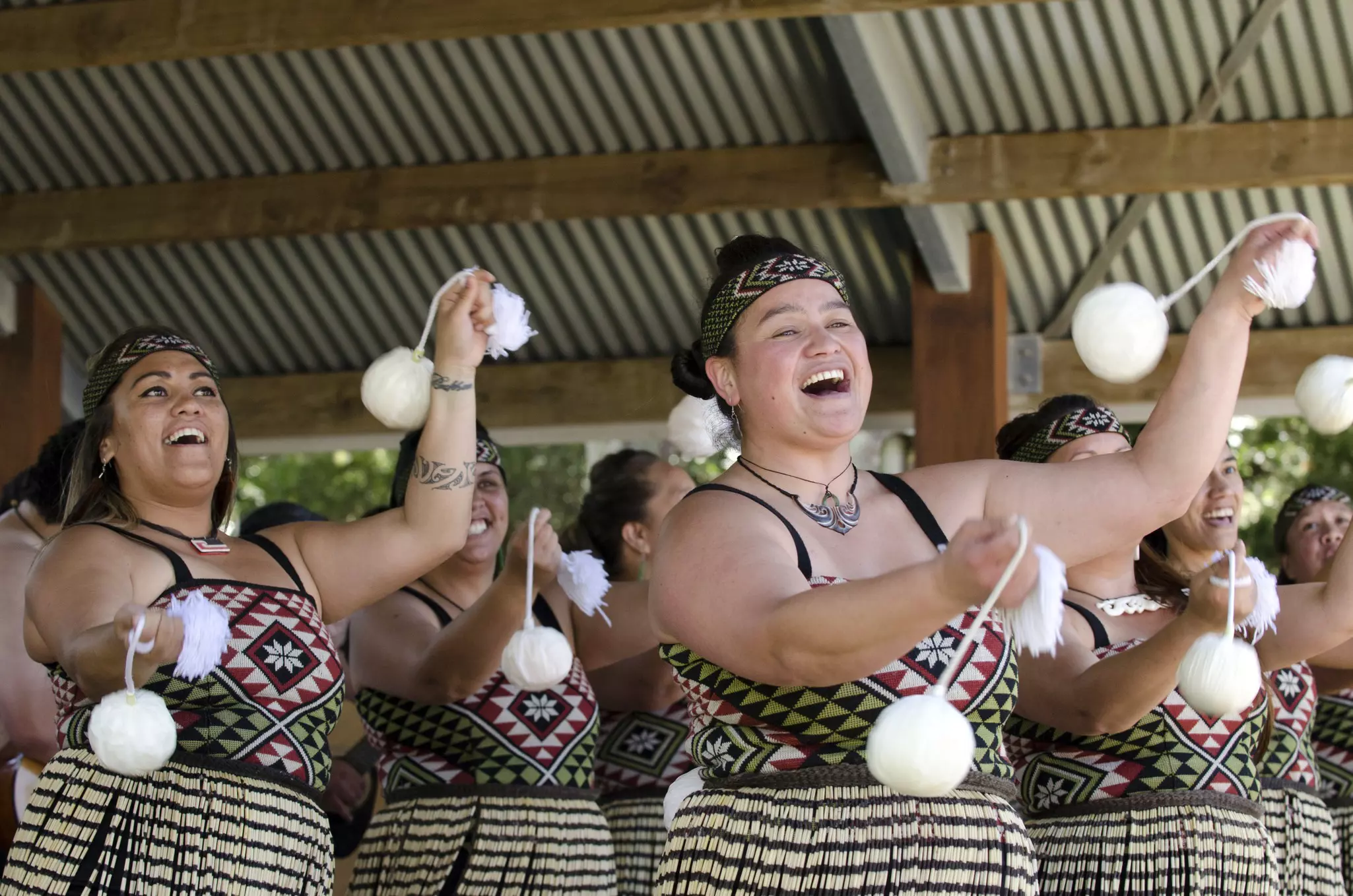 Maori women perform POI dance during Waitangi Day Waitangi NZ.It's a New Zealand public holiday to celebrate the signing of the Treaty of Waitangi in 1840.