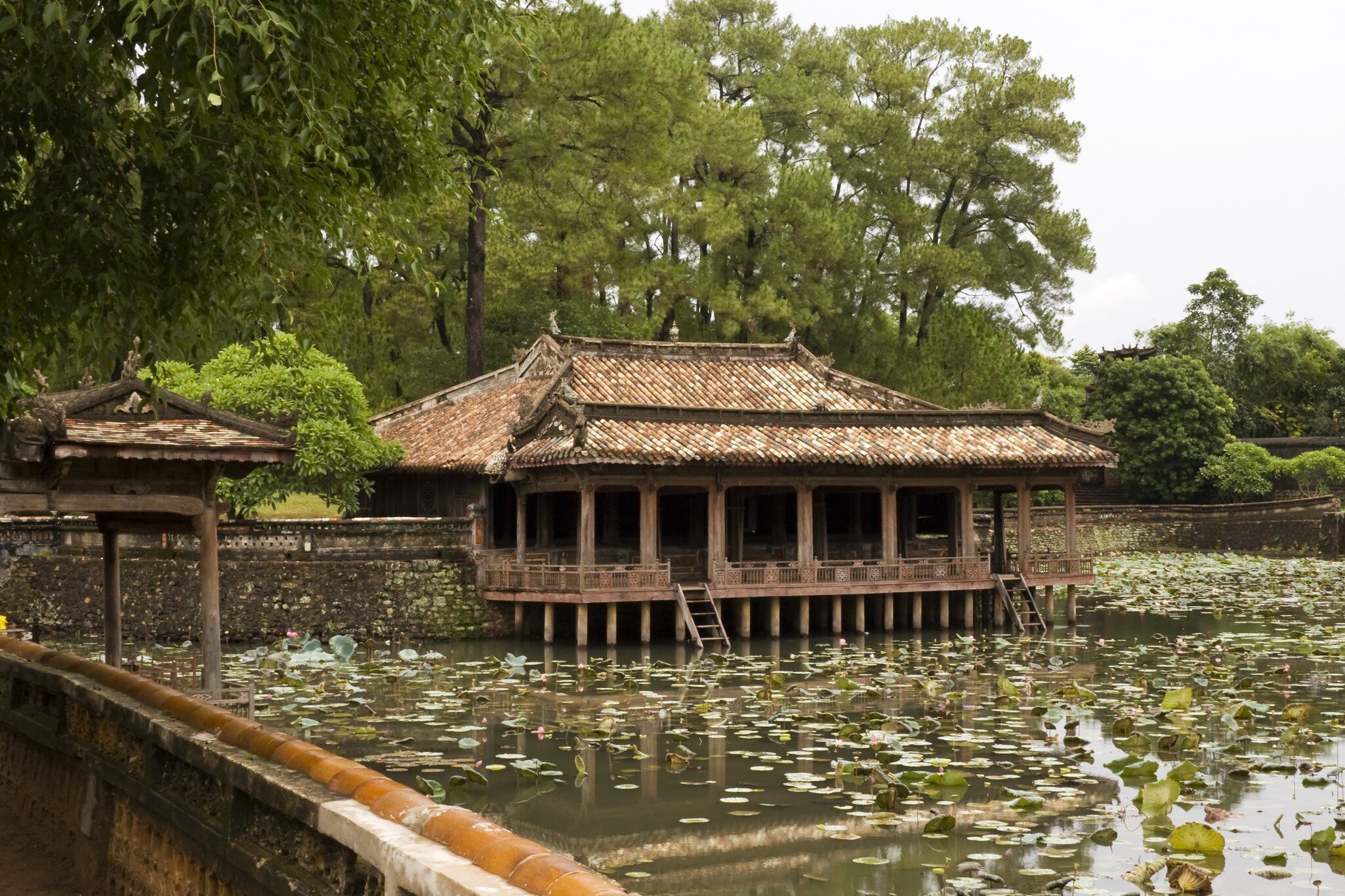 Raining on pond and lotus flower. Tu Duc Tomb, Hue. Pavilion of  imperial tomb Nguyen dynasty - Vietnam; Shutterstock ID 28059859; Your name (First / Last): Josh Vogel; Project no. or GL code: 56530; Network activity no. or Cost Centre: Online-Des...