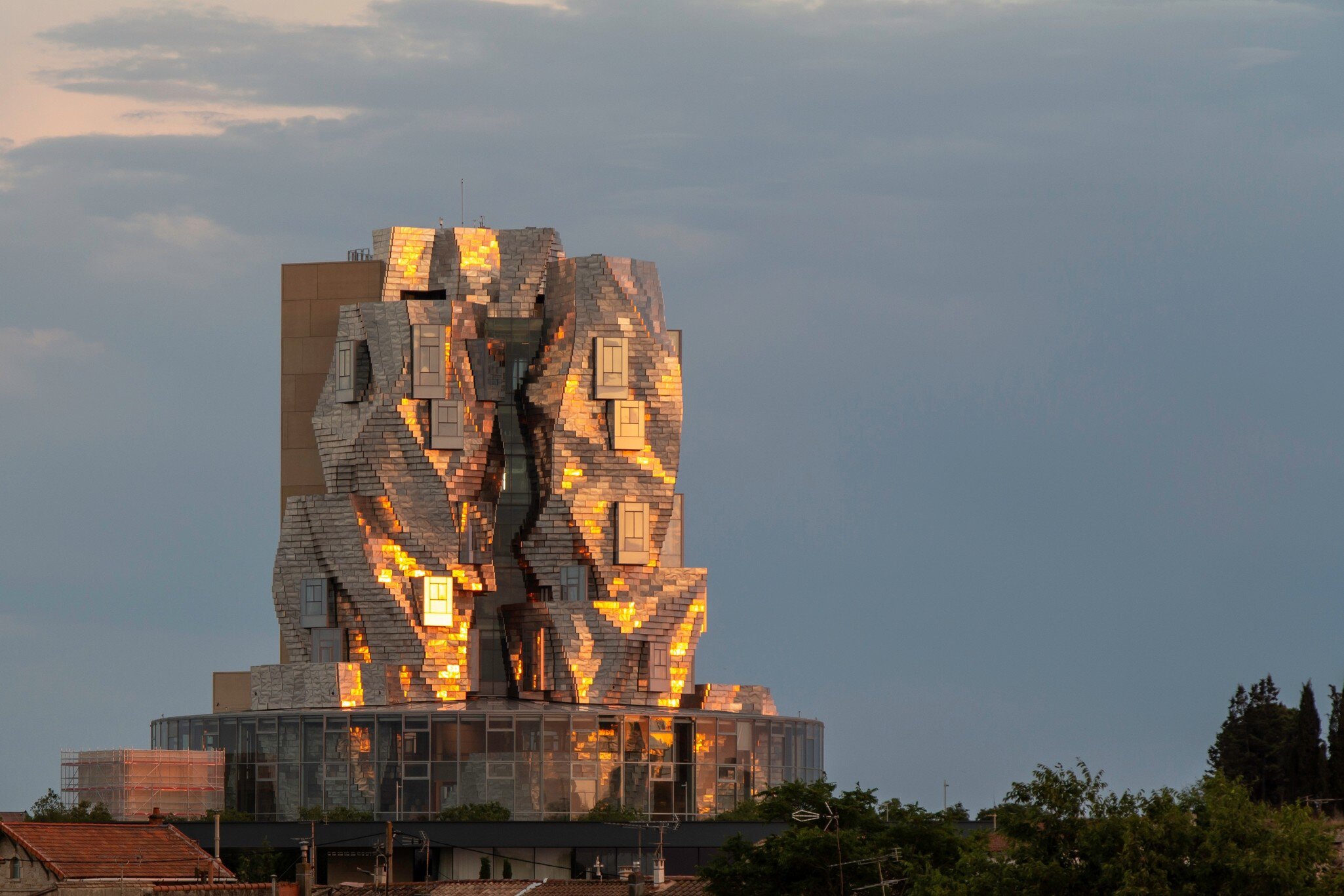 Arles, France. Luma Tower with golden reflections of the evening sun on the metallic structure. This tower is part of the project of Maja Hoffmann in Camargue.
