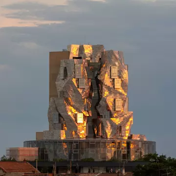 Arles, France. Luma Tower with golden reflections of the evening sun on the metallic structure. This tower is part of the project of Maja Hoffmann in Camargue.